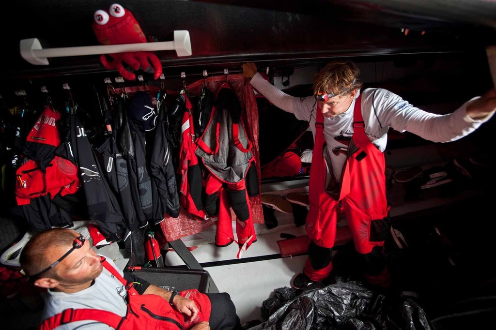 Ken Read and Ryan Godfrey talking down below under the watchful eyes of team mascot Marmo. PUMA Ocean Racing powered by BERG during leg 2 of the Volvo Ocean Race 2011-12 © Amory Ross/Puma Ocean Racing/Volvo Ocean Race http://www.puma.com/sailing
